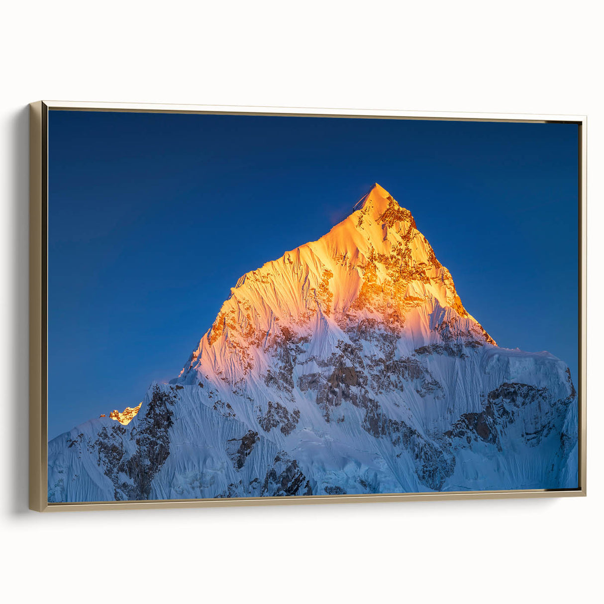 Framed canvas of vintage-style landscape painting depicting Mount Everest in black and gold tones.