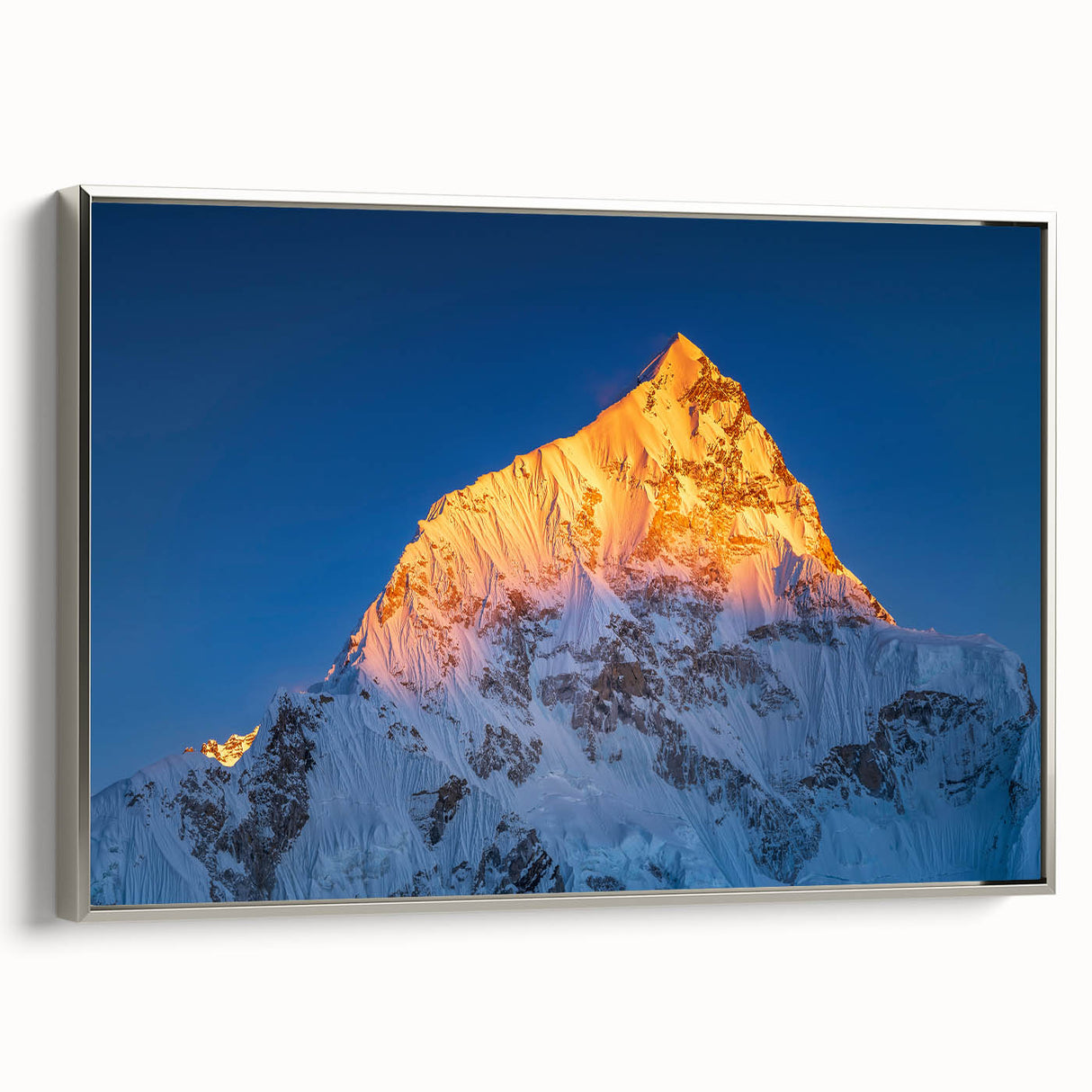 Framed canvas depicting a vintage landscape art painting of Mount Everest, featuring colorful art on a black background.