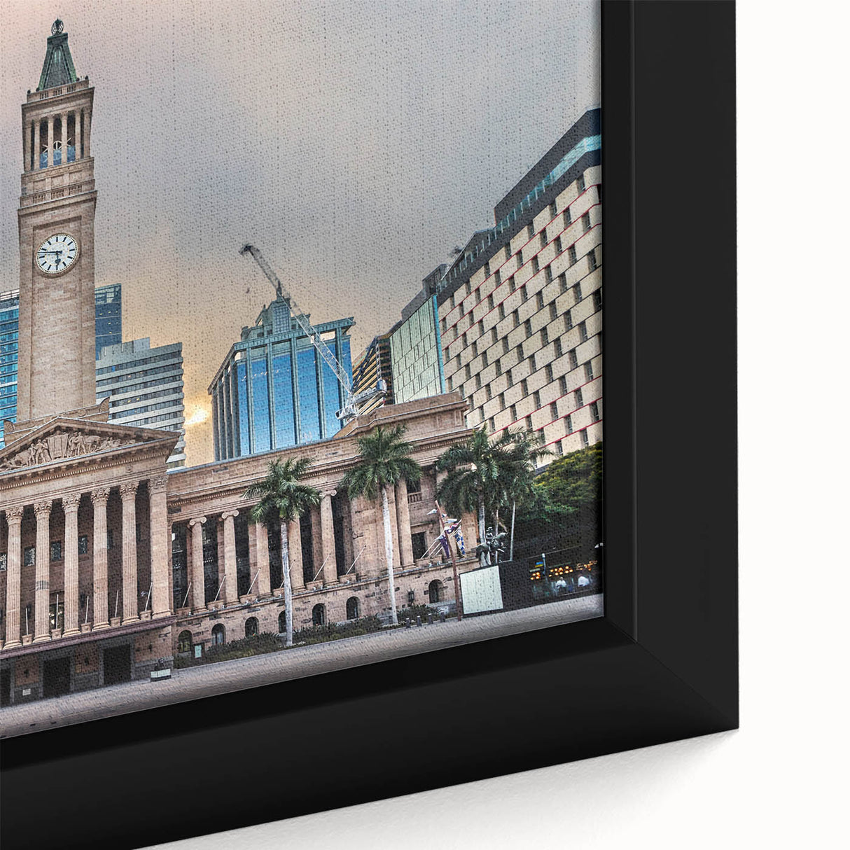 Close-up of a textured black wall art depicting Brisbane scenery on a framed canvas, with vibrant color accents.