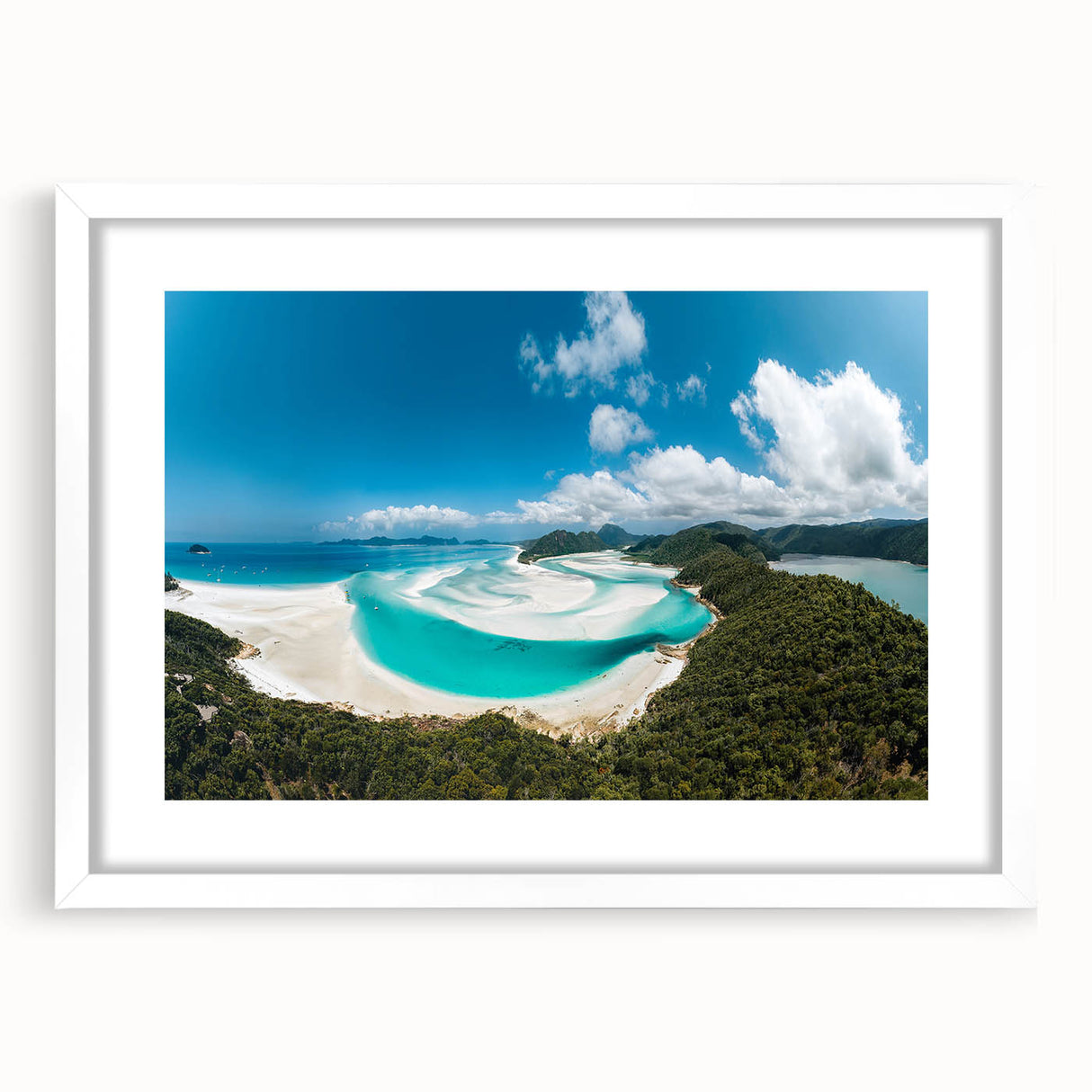 Extra large abstract art print of the Great Barrier Reef in vibrant blue and green hues on a white framed canvas.