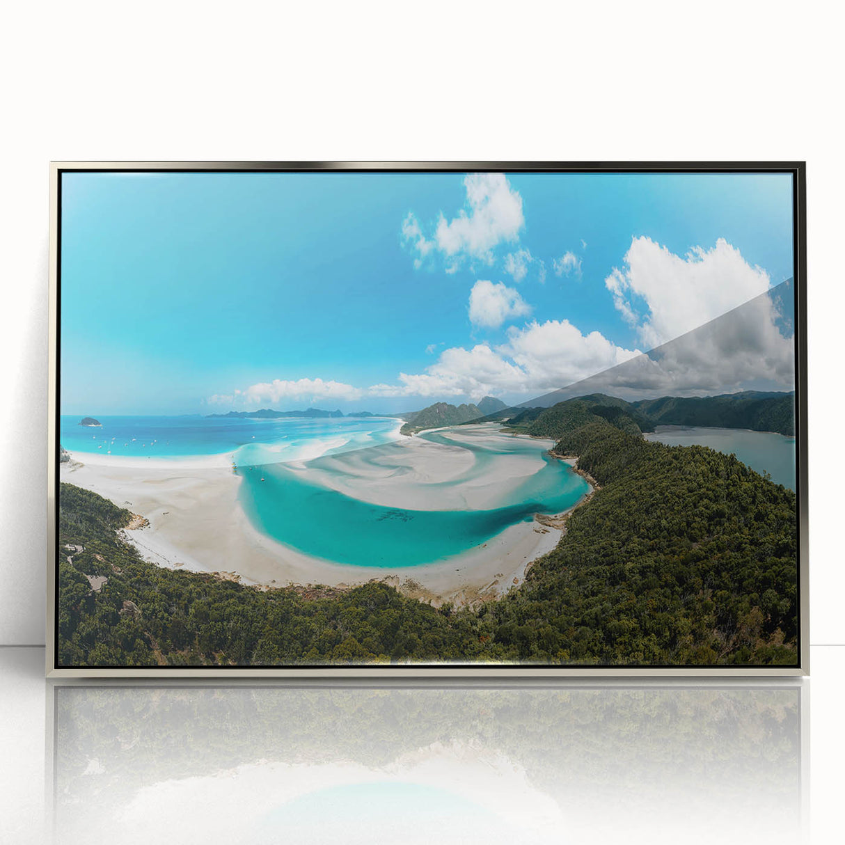 Art deco poster of the Great Barrier Reef in vibrant blue and green tones, silver-framed acrylic.
