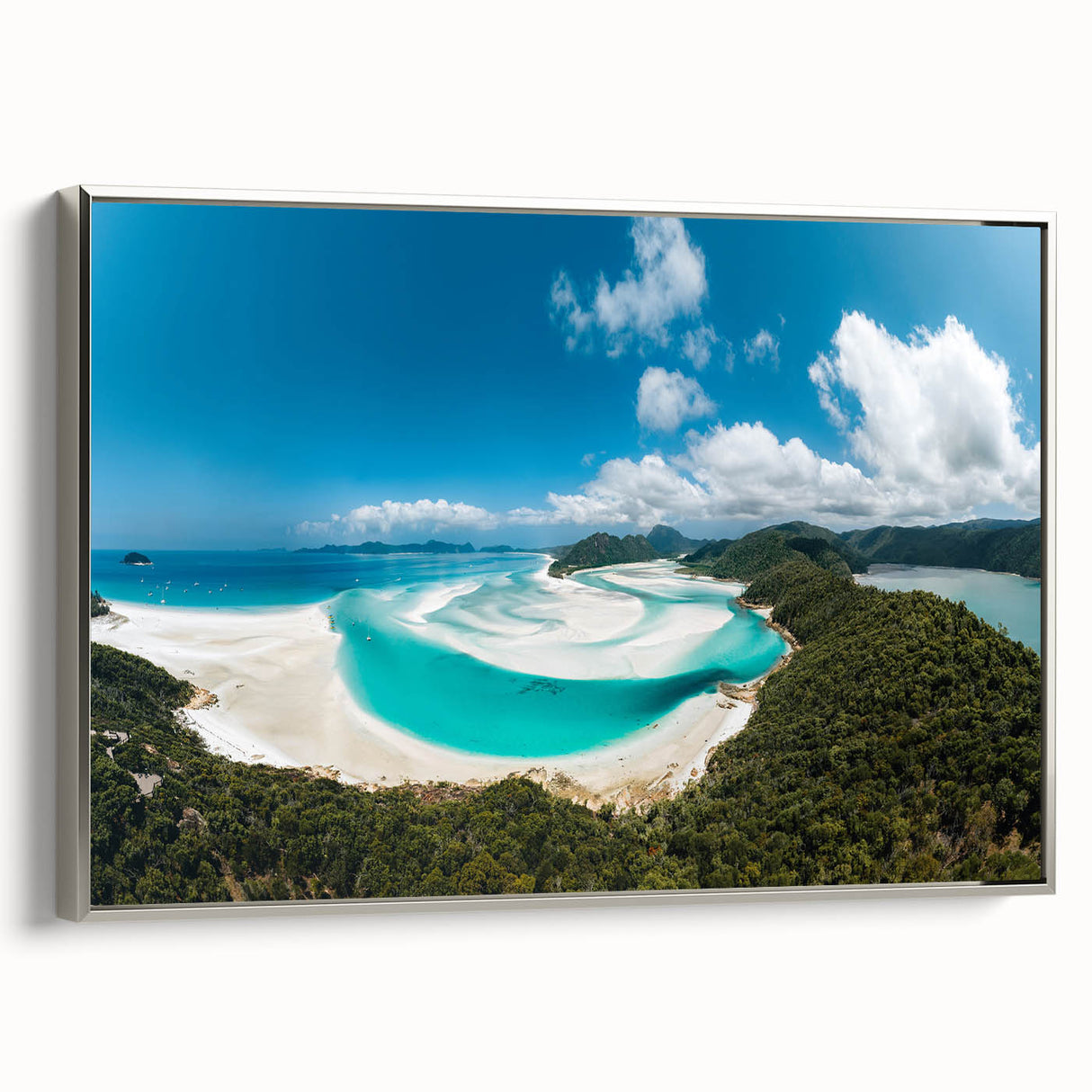 Vintage poster art of the Great Barrier Reef on framed canvas, featuring vibrant blue and green tones.
