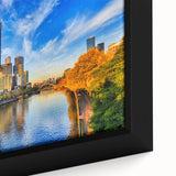 Black wall art featuring a textured Melbourne cityscape with colorful accents on a framed canvas.