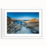 Extra large abstract art print of Tasmania scenery in muted earth tones on a textured canvas, framed in white.