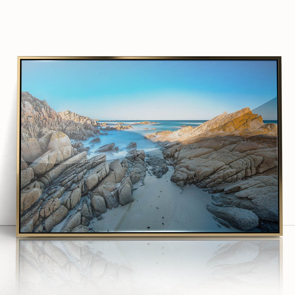 Mid-century modernist art depicting Tasmania landscape in gold and green tones on a framed acrylic print.
