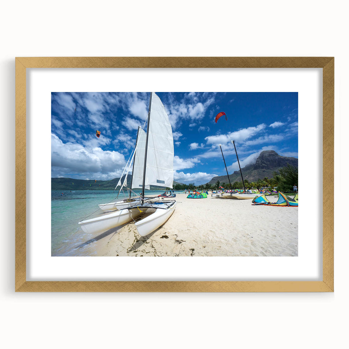 Abstract art print depicting Caribbean scenery in vibrant blue and green tones, framed in gold, ideal for dining room decor.