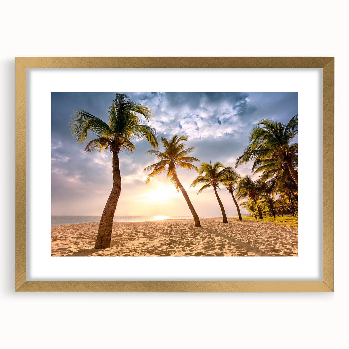 Abstract art print featuring a Caribbean scenery in muted blue and green tones on a framed gold mat.