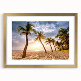 Abstract art print featuring a Caribbean scenery in muted blue and green tones on a framed gold mat.