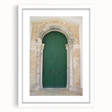 Abstract art print of a Caribbean scene in muted blue and green tones on a framed white mat, ideal for dining room decor.
