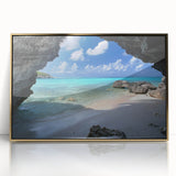 Art deco poster of a Caribbean scene in vibrant blues and greens, framed in gold acrylic.