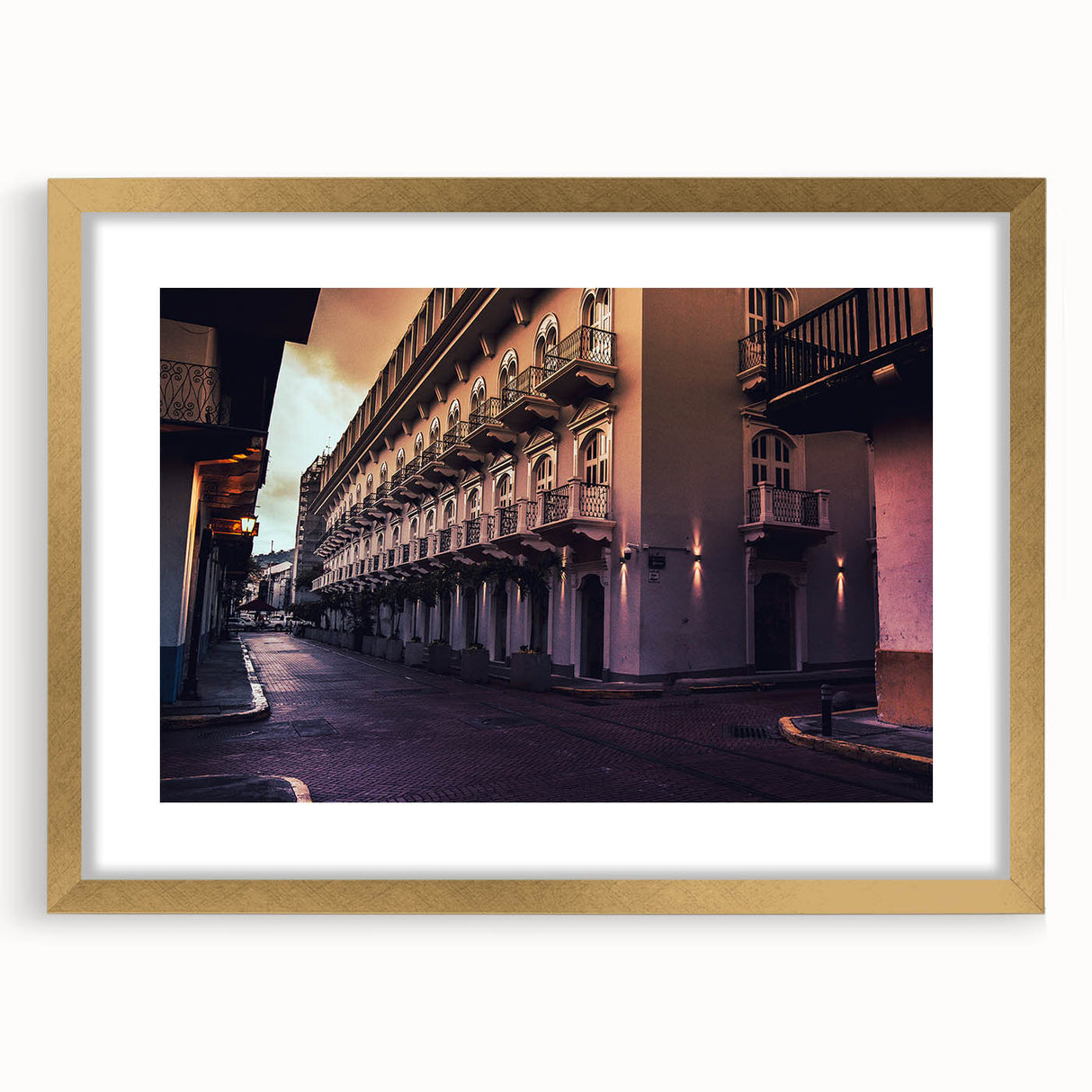 Textured abstract art print of Central American scenery in muted earth tones on a framed gold canvas.