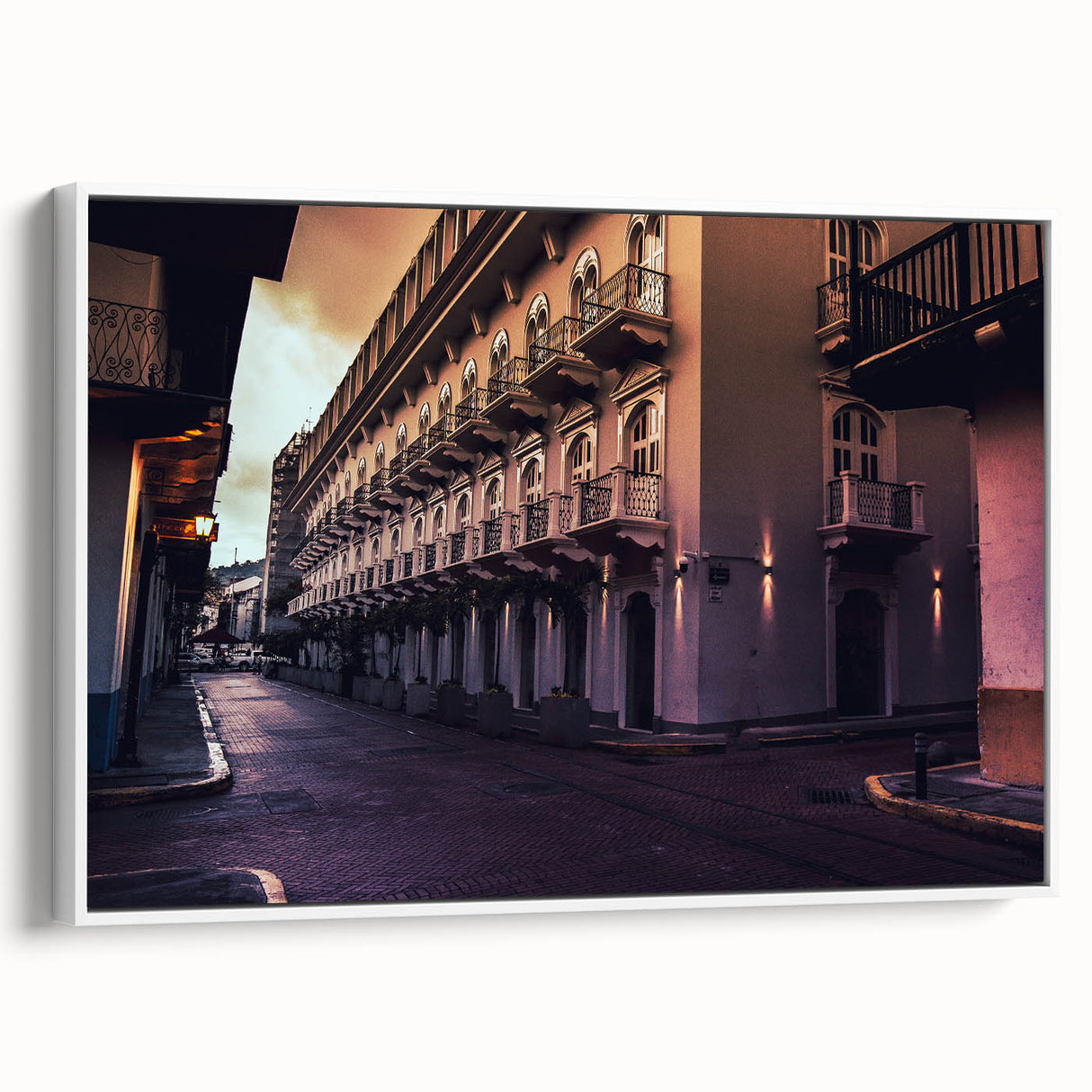 Vintage poster art of a Central American scene on a framed canvas, featuring vibrant colors against a black background.