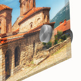 Large abstract wall art depicting a European scenery in muted earth tones on acrylic glass.