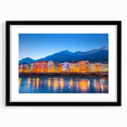 Colorful abstract art print of a European landscape, in a black frame with mat, ideal for living room decor.