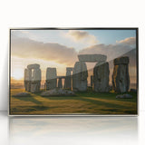 Mid-century modernist art depicting Stonehenge, with muted earth tones, framed in silver acrylic.