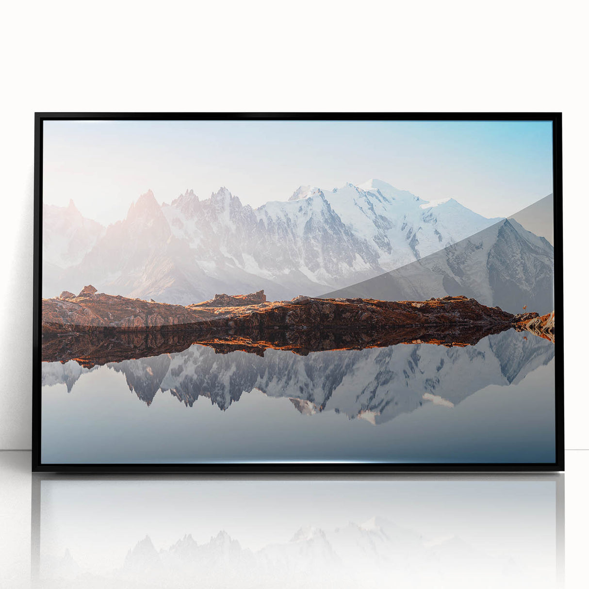 Large abstract wall art depicting the French Alps in muted gray and blue tones, framed in black acrylic.