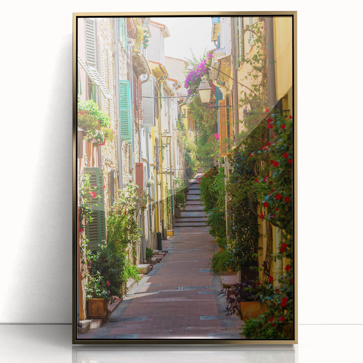 Art deco poster of Provence landscape in muted gold and green tones, acrylic print framed in gold.