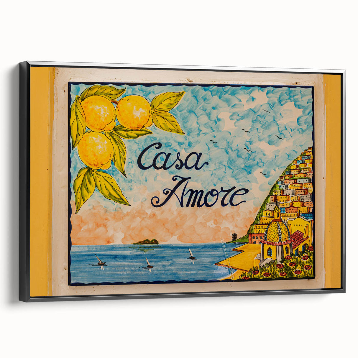 Black and white framed canvas of the Amalfi Coast landscape, ideal for bedroom wall decor.