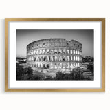 Abstract art print of the Colosseum in muted gold and cream tones, framed with a gold mat.
