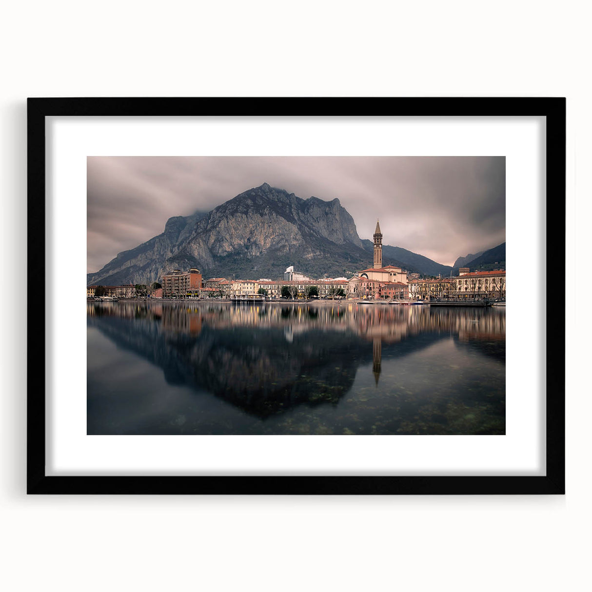 Extra large abstract art print of Lake Como with vibrant colors on textured canvas, framed in black.