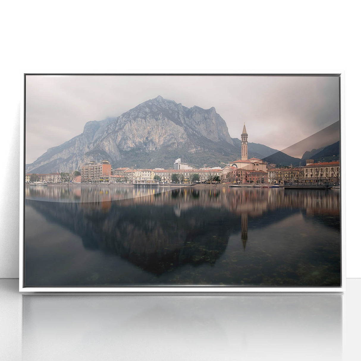 Mid-century modernist art depicting Lake Como with muted blue and green hues on a framed acrylic.