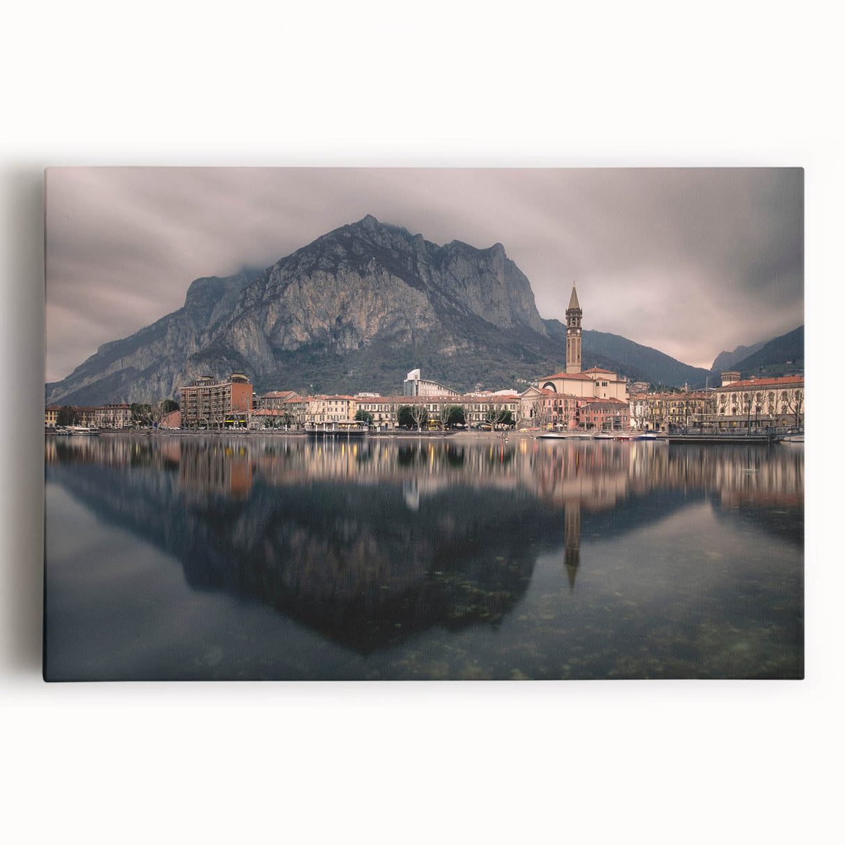 Black and white photo of Lake Como on stretched canvas, featuring serene water and distant mountains.