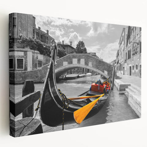A stretched canvas print of Venice's scenic canal in muted earth tones, suitable for kitchen wall art.