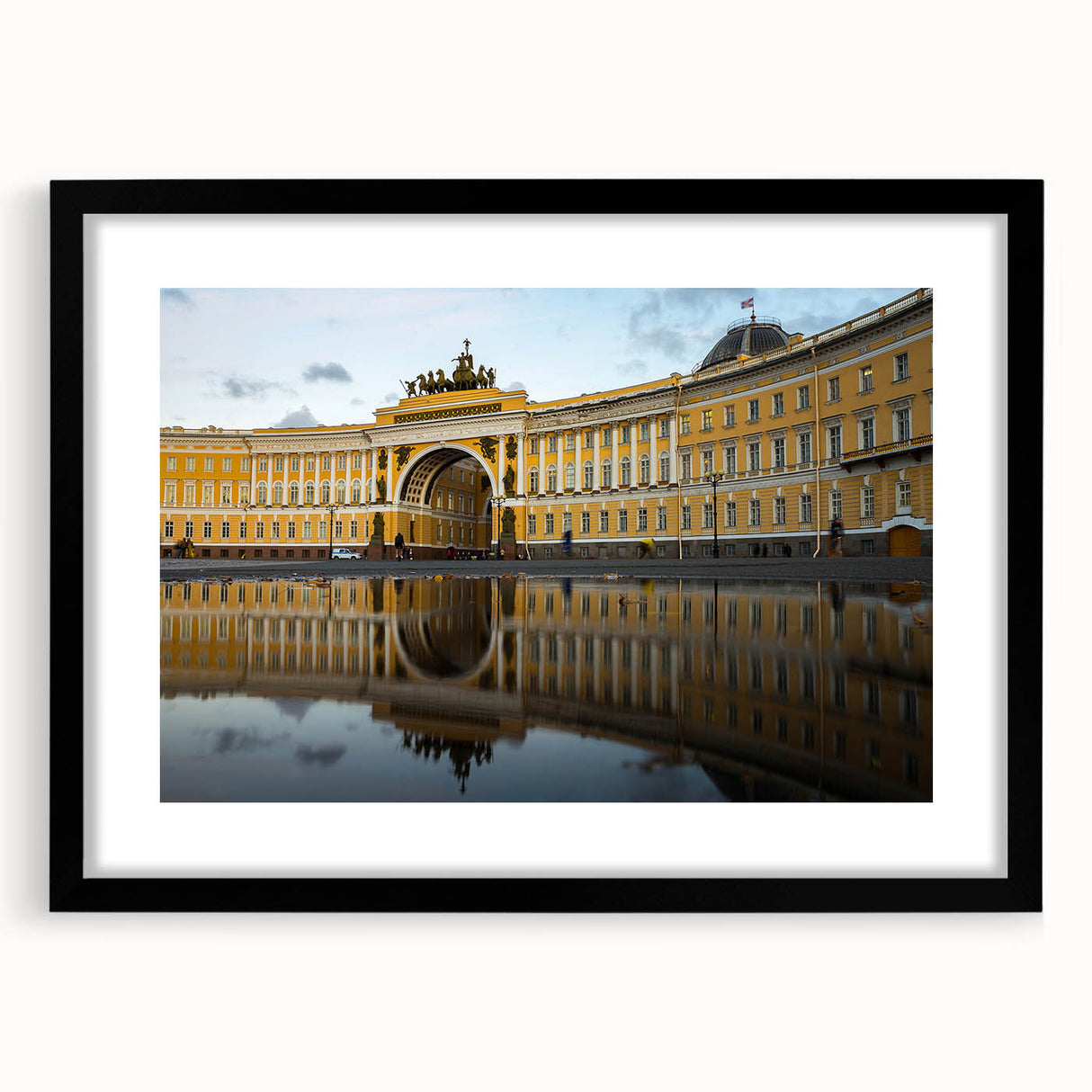 Extra large abstract art print of a colorful, textured portrayal of a European cityscape in a black frame.