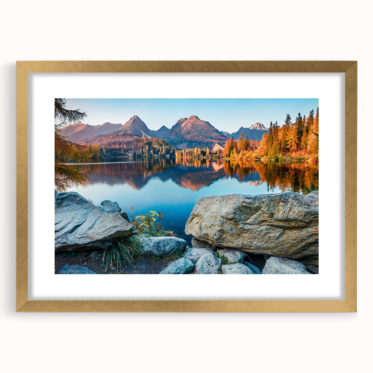 Abstract art print of a European scenery in muted gold and green tones, framed with a mat, suitable for dining room decor.