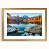Abstract art print of a European scenery in muted gold and green tones, framed with a mat, suitable for dining room decor.