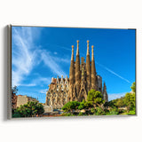 Framed canvas featuring a vintage-style landscape painting of Barcelona with colorful elements on a black background.