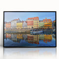 Large abstract wall art depicting Stockholm's skyline in muted gray and blue tones, framed in black acrylic.