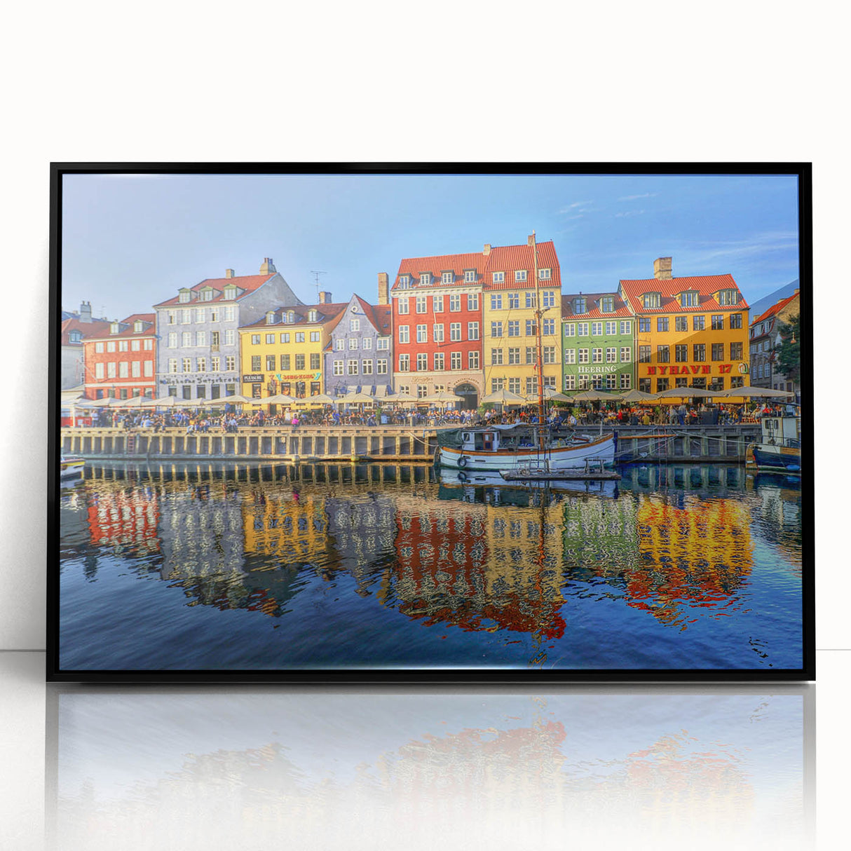 Large abstract wall art depicting Stockholm's skyline in muted gray and blue tones, framed in black acrylic.