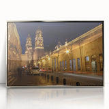 Mid-century modernist art depicting Mexico City scenery in muted tones on a silver-framed acrylic.