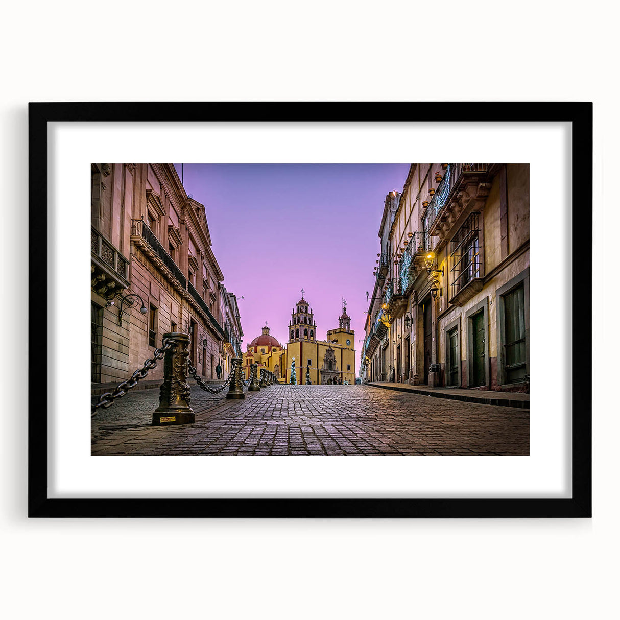 Extra large abstract art print of colorful, textured scenery of Guanajuato, in a black frame, ideal for living room decor.