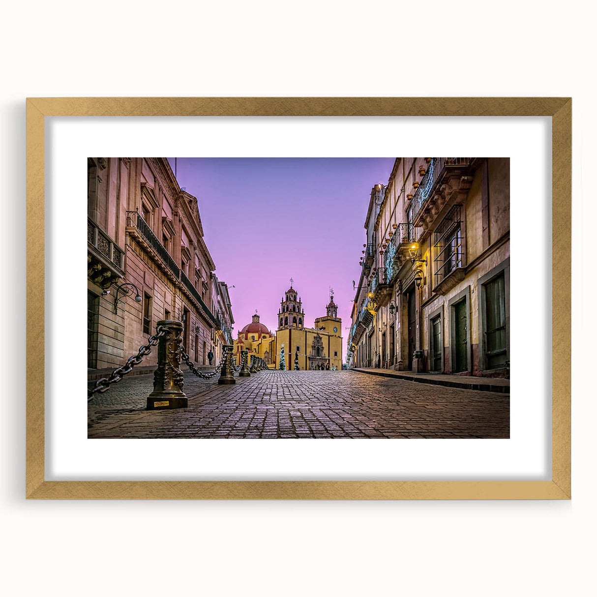 Extra large abstract art print of Guanajuato scenery in vivid colors on a gold-framed canvas, ideal for living room decor.