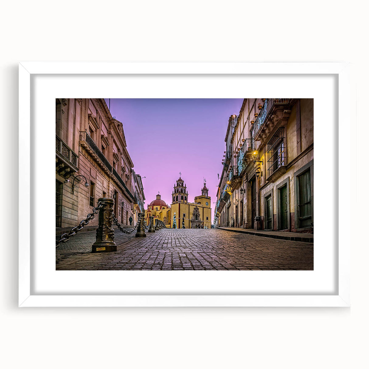 Abstract art print of Guanajuato, Mexico, in vibrant hues on a framed white mat, ideal for dining room decor.