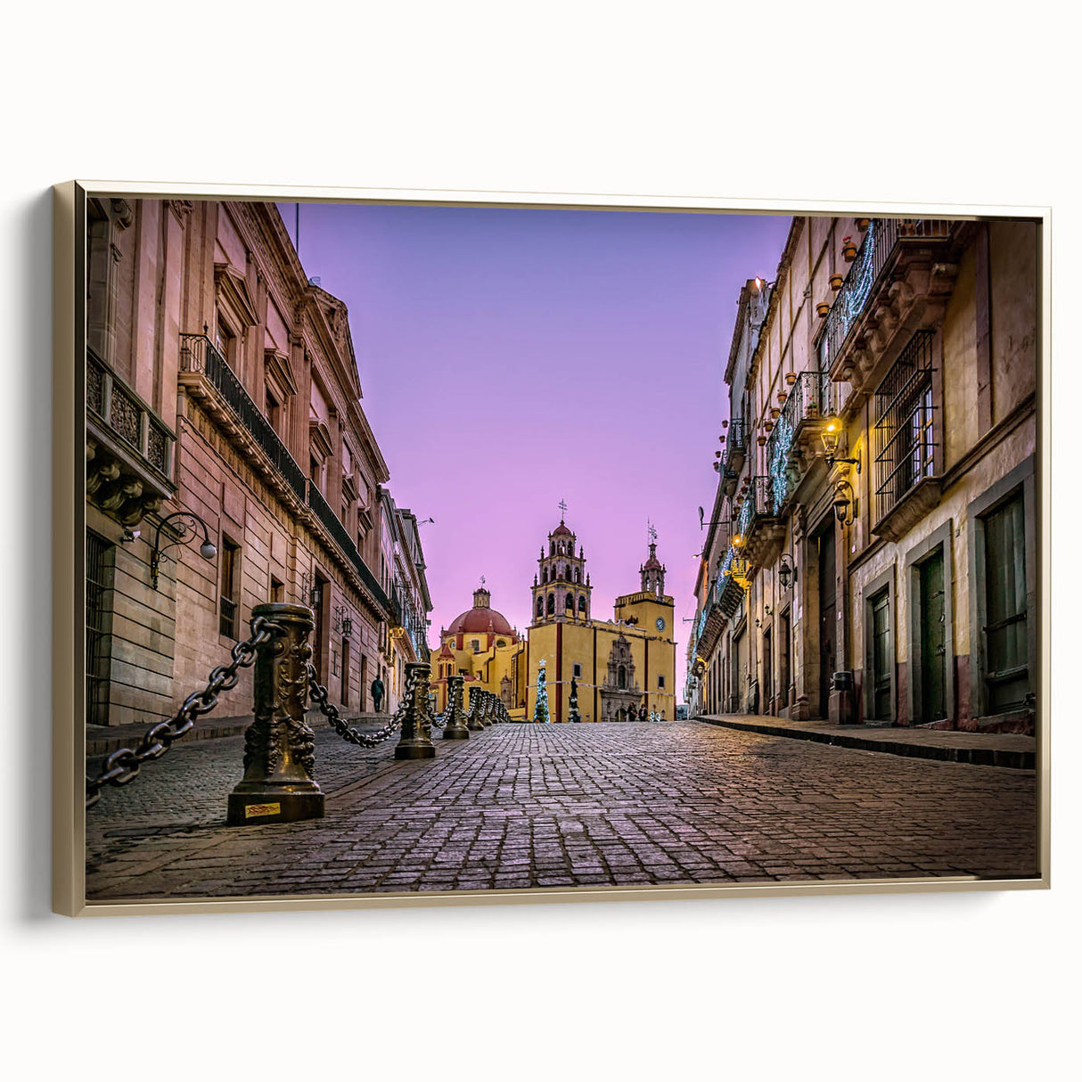 Framed canvas wall art depicting a vintage-style landscape of Guanajuato, Mexico, in muted gold and black tones.