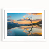 Abstract art print of Oaxaca scenery in muted earth tones on a framed white mat, ideal for dining room decor.