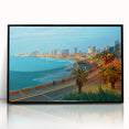Large abstract wall art featuring a stylized Tel Aviv cityscape in muted gray and blue tones, framed in black acrylic.