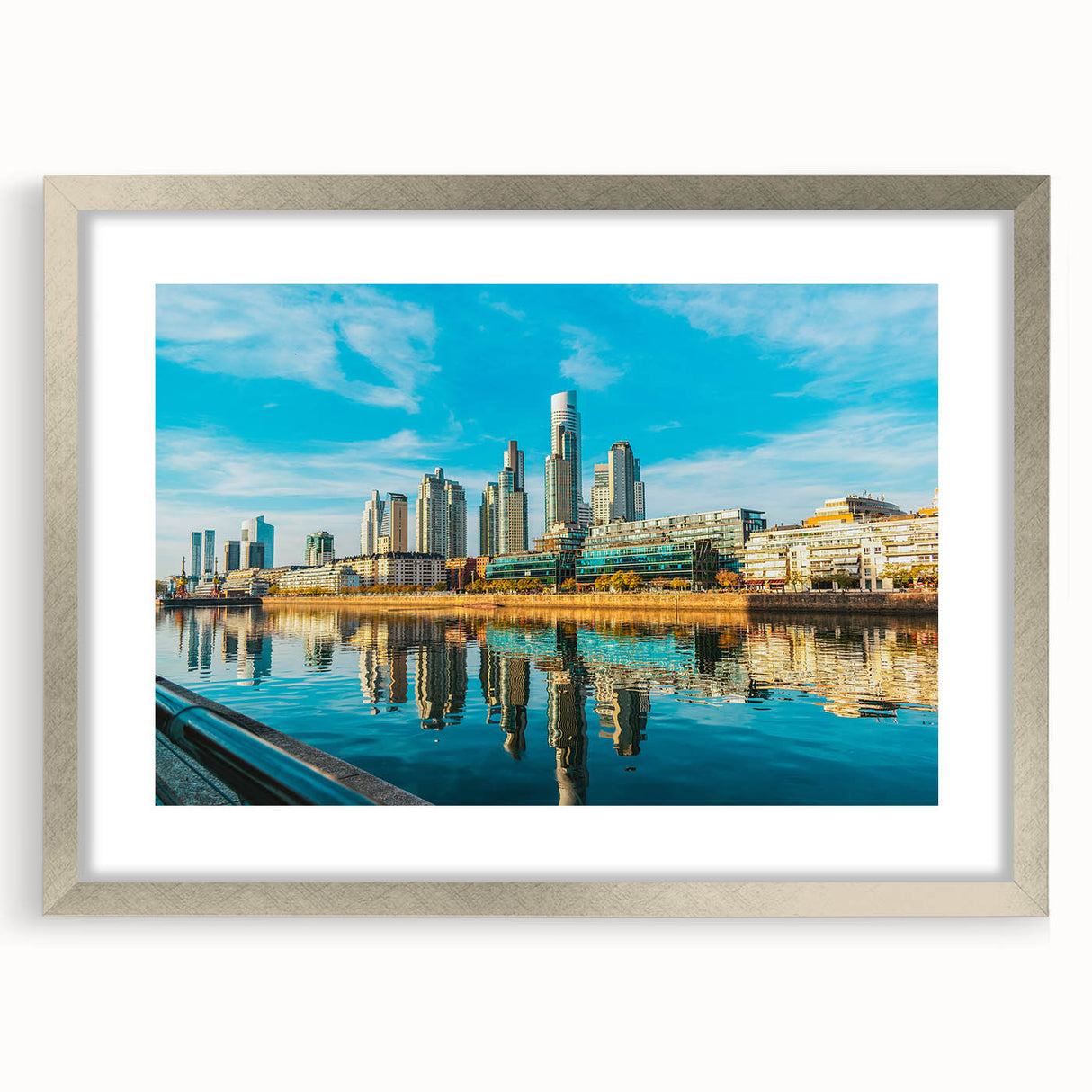 Textured abstract art print of a muted blue and gray Buenos Aires cityscape, framed in silver, ideal for bedroom art.