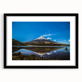 Abstract art print featuring colorful, textured scenery of South America on a large black-framed canvas.