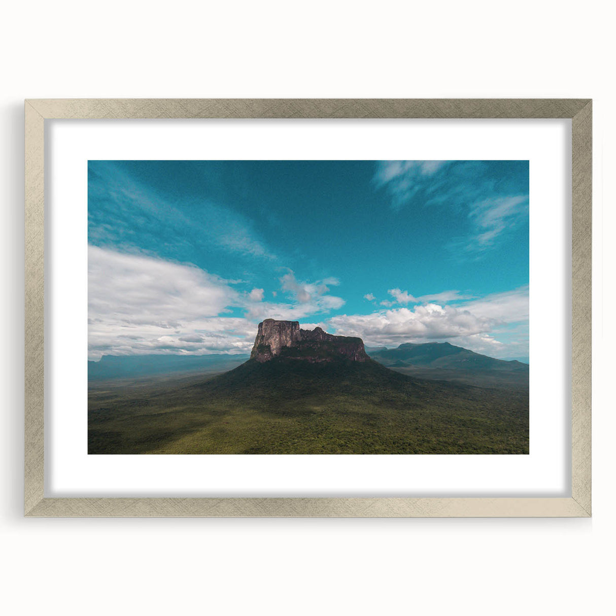 Textured abstract art print of a Venezuelan landscape with earthy tones on a silver-framed canvas.