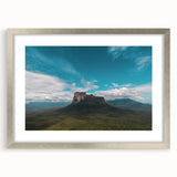 Textured abstract art print of a Venezuelan landscape with earthy tones on a silver-framed canvas.