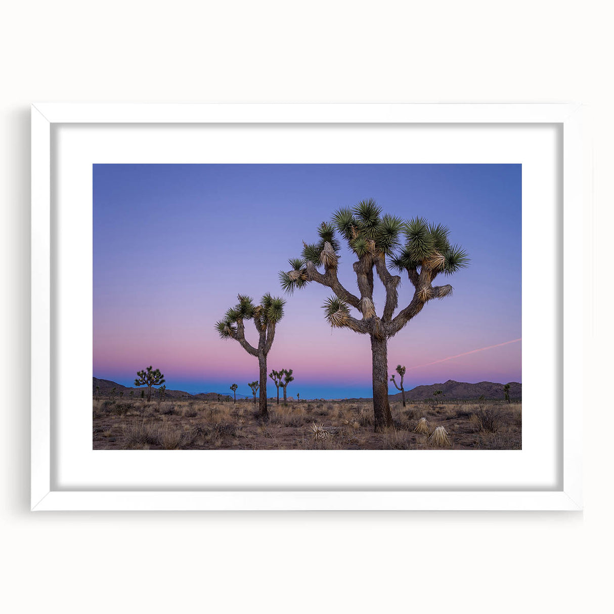 Abstract art print of Joshua Tree in muted earth tones on a white framed canvas, suitable for bedroom or dining room decor.