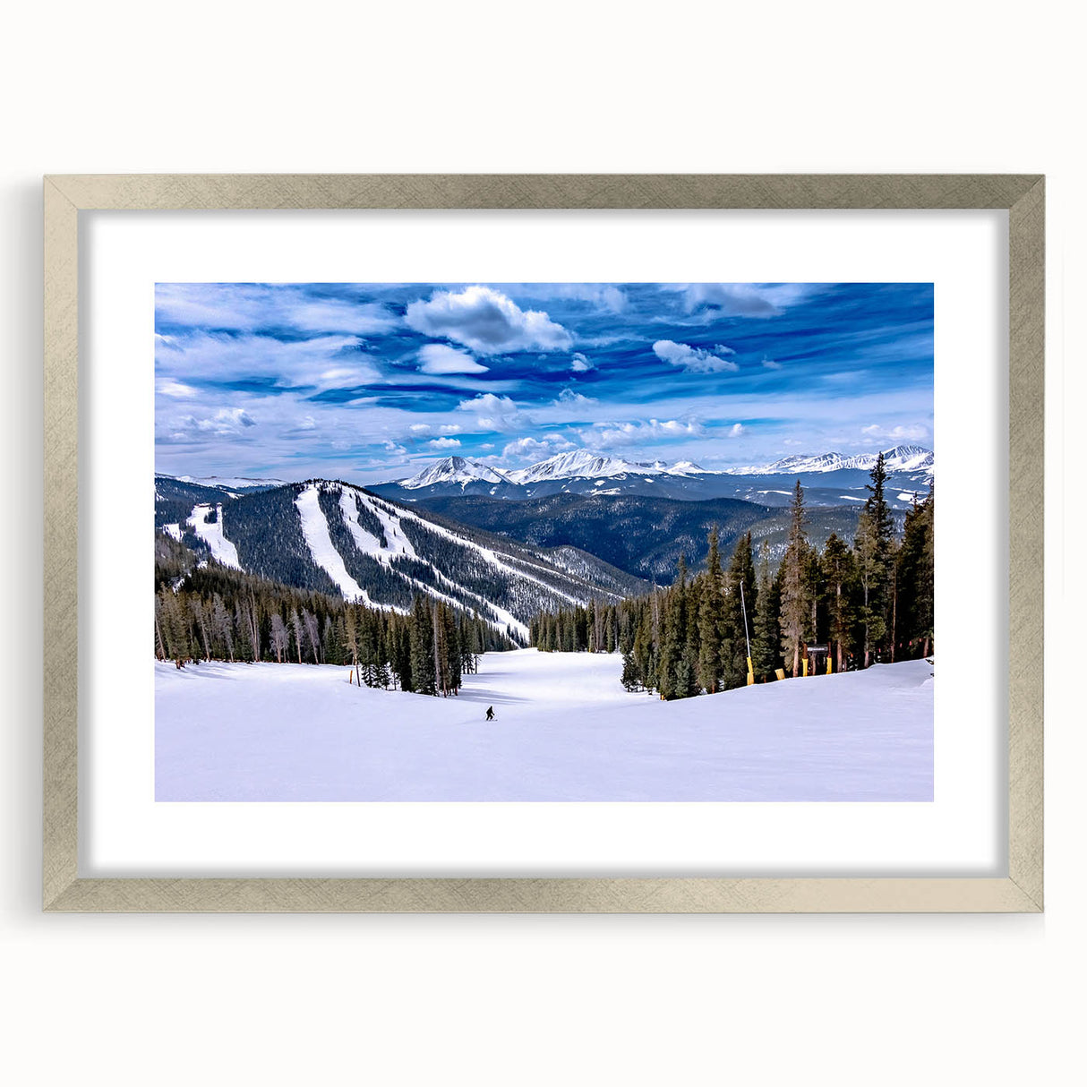 Textured art depicting abstract scenery in muted earth tones on a framed silver mat, suitable for bedroom decor.