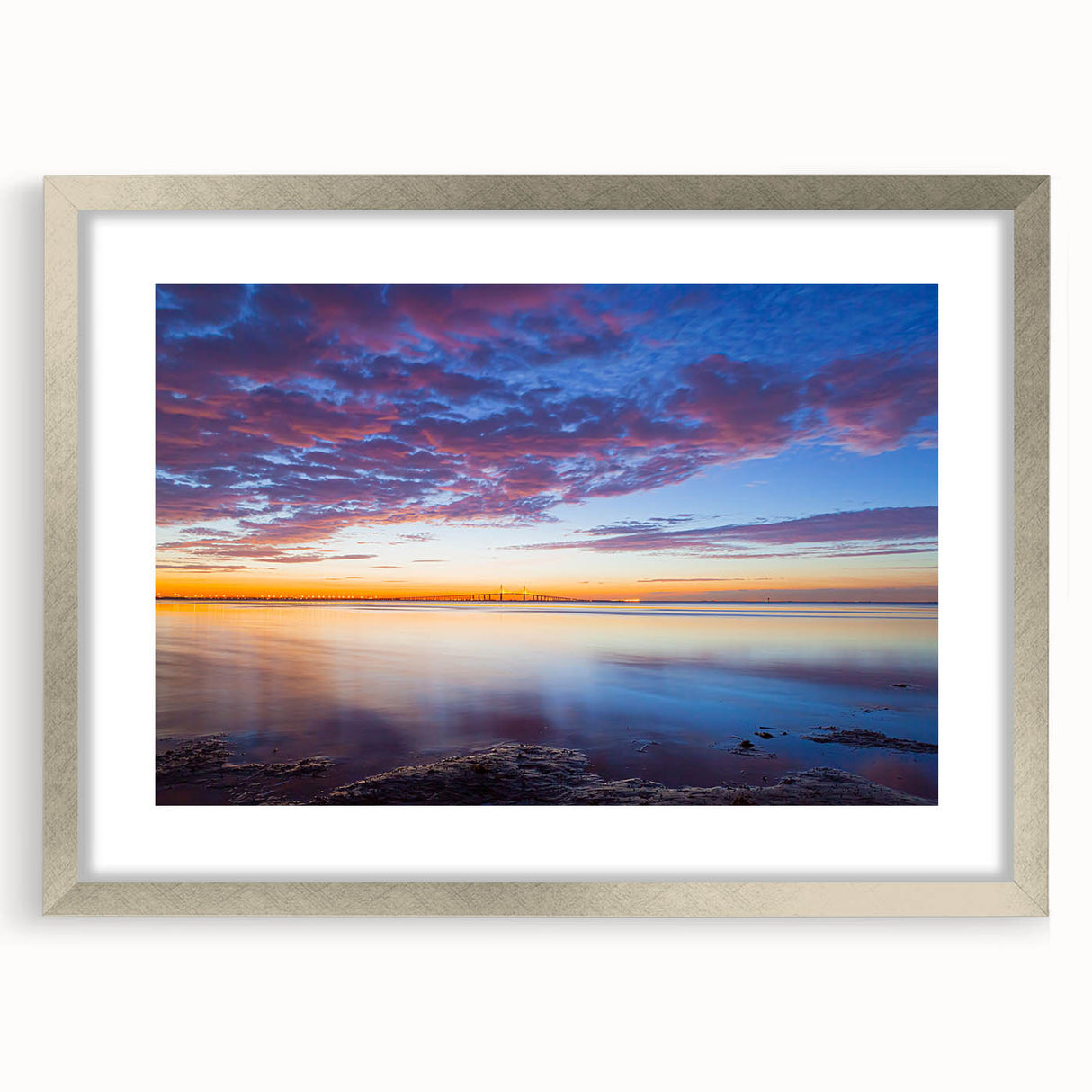 Textured art print of abstract Florida Keys scenery in muted blue and green tones, framed in silver.