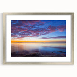 Textured art print of abstract Florida Keys scenery in muted blue and green tones, framed in silver.