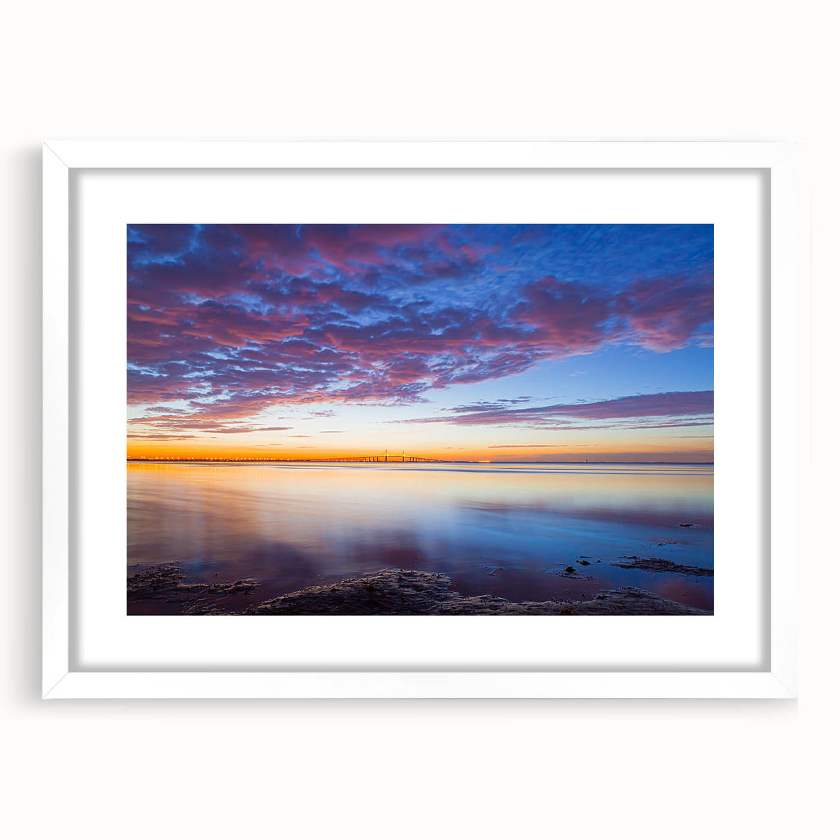 Abstract art print of the Florida Keys in muted blue and green tones, framed with a white mat, ideal for dining room decor.