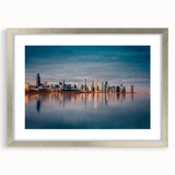 Textured art print of abstract Chicago skyline in muted blues and grays, framed with a silver mat.